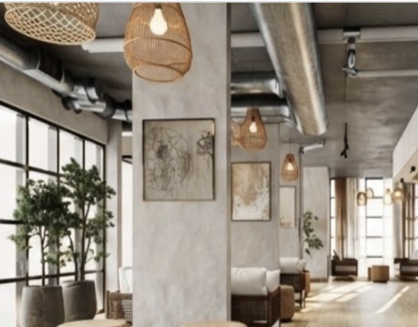 The Clara Tapestry lobby lounge with woven pendants and greenery