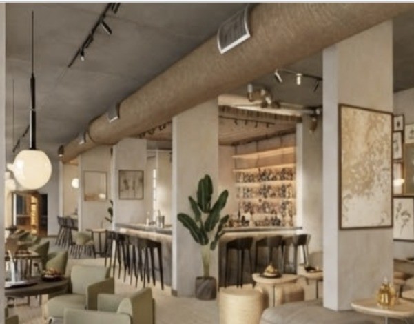 The Clara Tapestry bar with exposed ceiling and warm globe lighting