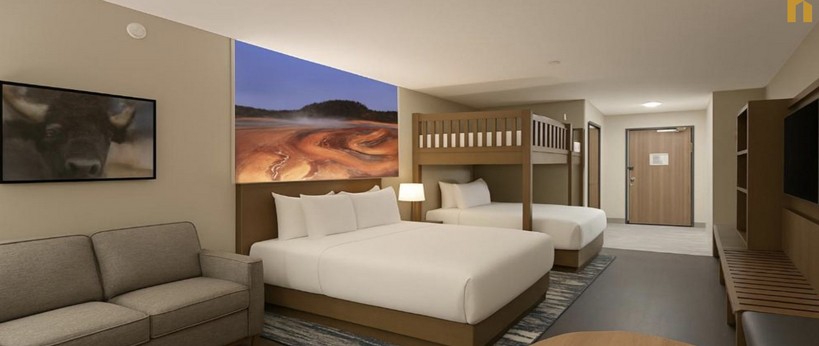 Starlite Yellowstone guestroom with bunk beds and landscape artwork